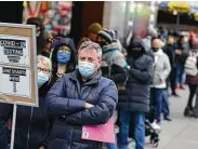  ?? Seth Wenig / Associated Press ?? People wait in line at a testing site last month in New York City. Scientists say there are more variants to come after omicron.