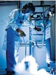  ??  ?? Frozen in time: a technician fills a cryostorag­e tank with liquid nitrogen