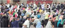  ?? JAMIE RHODES, USA TODAY SPORTS ?? People gather to pray Thursday during the Jenazah for Muhammad Ali at the Kentucky Exposition Center in Louisville.