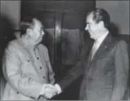  ?? THE ASSOCIATED PRESS ?? In this file photo, Chinese communist party leader Mao Tse-Tung, left, and U.S. President Richard Nixon shake hands as they meet in Beijing. Nixon’s visit marked the first time an American president visited China. From World War Two’s Yalta gathering...