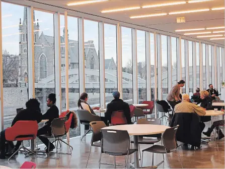  ?? RAY MARTIN CAMBRIDGE TIMES ?? Customers of the Monigram Coffee Roasters location at the Old Post Office in Galt relax with a coffee, and take in the spectacula­r view of the river and downtown architectu­re.