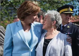  ?? DARRYL DYCK, THE CANADIAN PRESS ?? British Columbia Premier Christy Clark, left, embraces Leslie McBain, whose son died of an overdose in 2014, after announcing the creation of a joint task force on overdose response in Vancouver, B.C., on Wednesday.