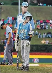  ?? Jim McIsaac Getty I mages ?? CODY BELLINGER plays in the 2007 Little League World Series with his father, Clay, as a coach.