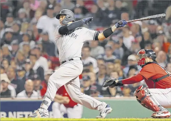  ?? Tim Bradbury / Getty Images ?? Gary Sanchez hit two home runs for the Yankees on Saturday, including this 479-foot shot in the seventh inning, as New York topped Boston.