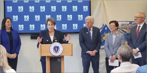  ?? MATTHEW MEDSGER — BOSTON HERALD ?? Gov. Maura Healey, joined by Lt. Gov. Kim Driscoll (left), UMass President Marty Meehan, UMass Lowell Chancellor Julie Chen, and Lowell City Manager Tom Golden, announced Draper Labs would anchor a massive new economic developmen­t push in Lowell.