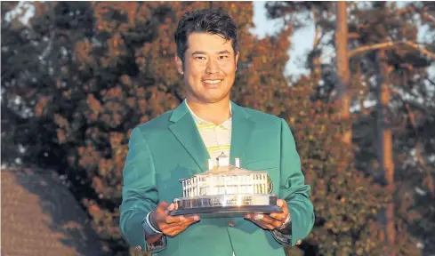  ?? AFP ?? Hideki Matsuyama poses with his green jacket and the trophy after winning the Masters at Augusta on Sunday.