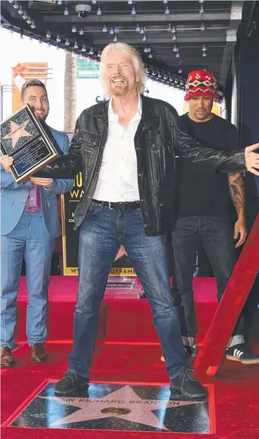  ?? Picture: AFP ?? STAR MAN: Sir Richard Branson poses on his Hollywood Walk of Fame star.