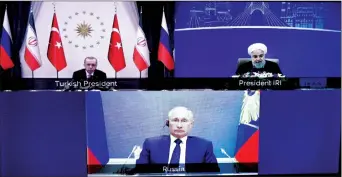  ??  ?? Vladimir Putin speaks with Turkey’s Recep Tayyip Erdoğan and Iran’s Hassan Rouhani during a video conference call on Wednesday