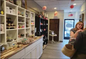 ?? ?? The gift shop at Just Delicious Scones in St. Clair Shores features specialty teas, books and tea-related items.