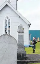 ?? Photo / Kate Durie ?? Bryan Mitchell dressed in the Scottish MacKay tartan while playing the bagpipe outside Te Awamutu St John’s Anglican Parish.