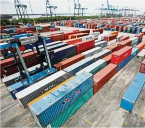  ??  ?? Important sector: A general view of a container yard at North Port in Port Klang. Exports play a prominent role in the economy, and what happens in the global trade arena is of great concern. — Reuters