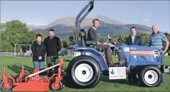  ??  ?? Members of Taynuilt Sports Council and Frank Beaton of Beaton and McMurchy Architects, with the new tractor and
mower.