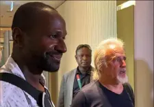  ?? AFP via Getty Images ?? French journalist Olivier Dubois, left, freed nearly two years after he was kidnapped in Mali, and U.S. national Jeffery Woodke, right, freed after being kidnapped in October 2016 in Niger, are seen as they arrive Monday at the Diori Hamani Internatio­nal Airport in Niamey, Niger.