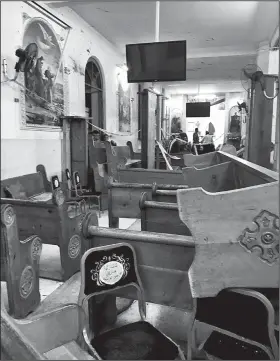  ?? AP/NARIMAN EL-MOFTY ?? Pews are overturned of Tanta, Egypt. inside the St. George Church after a bombing Sunday in the Nile Delta town