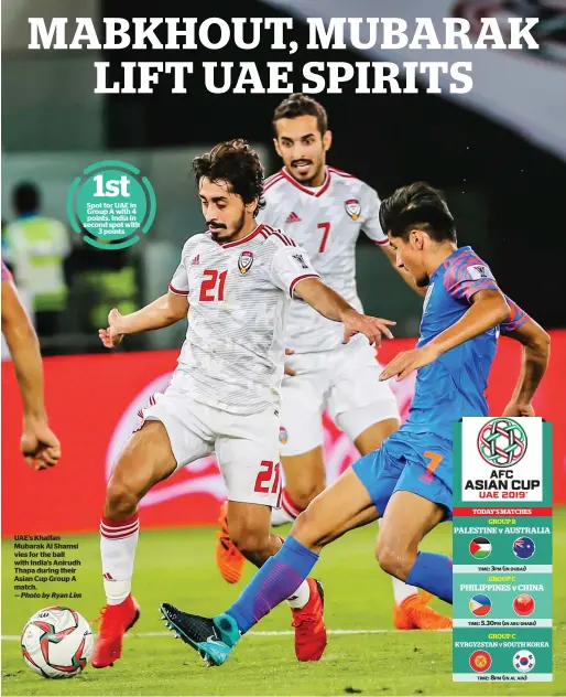  ?? — Photo by Ryan Lim ?? UAE’s Khalfan Mubarak Al Shamsi vies for the ball with India’s Anirudh Thapa during their Asian Cup Group A match. Spot for UAE in Group A with 4 points. India in second spot with 3 points