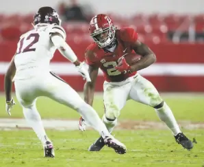  ?? Gary Cosby Jr. / Associated Press ?? Alabama running back Najee Harris ( 22) needs 501 yards to surpass 2015 Heisman winner Derrick Henry as the leading rusher in Crimson Tide history.