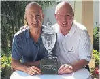  ?? HANDOUT PHOTO ?? Tournament founder Glenn Goodwin, right, presents the John Honderich Trophy to winner Mike Kray, who shot a 72 on Wednesday — the low round of the day.