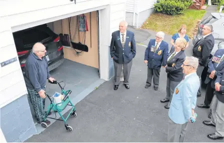  ?? GLEN WHIFFEN/THE TELEGRAM ?? Second World War Navy veteran Bill Saunders (left) turned 99 on Friday. Several members from his legion, Branch 1, Royal Canadian Legion, showed up Friday evening to sing him “Happy Birthday.” Among them, in the light blue uniform was Korean War veteran 90-year-old Doug England.