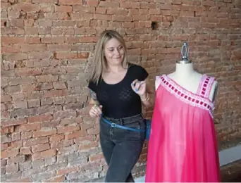  ??  ?? Above: Marissa Vogel admires a unionmade vintage chiffon garment in her studio in Lawrencevi­lle.