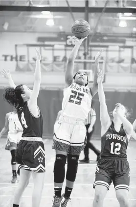  ?? NICOLE MUNCHEL/BALTIMORE SUN MEDIA GROUP ?? Aberdeen's Tristyn DeVeaux goes up for a layup during the 3A North regional championsh­ip game against Towson on Saturday. The Eagles advance to the state semifinals.