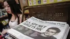  ?? PHILIPPE LOPEZ/AFP/GETTY IMAGES ?? The Hong Kong’s South China Morning Post in June 2013 put the story of U.S. intelligen­ce whistleblo­wer Edward Snowden on its front page.