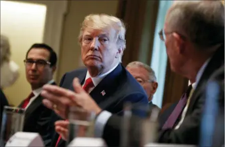  ?? EVAN VUCCI — THE ASSOCIATED PRESS ?? President Donald Trump listens during a meeting with Republican members of Congress on immigratio­n in the Cabinet Room of the White House, Wednesday in Washington.