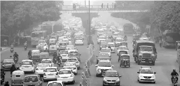  ?? — Reuters photo ?? Vehicles driving through smog in New Delhi, India in this file photo.