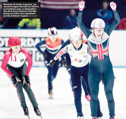  ??  ?? Marianne St-gelais, à gauche, traversant la ligne d’arrivée du 1000 m au troisième rang. La disqualifi­cation de la Sud-coréenne Choi Minjeong, au centre, lui a cependant permis d’obtenir l’argent.