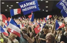  ??  ?? MONSWILLER: Supporters cheer candidate for the presidenti­al election, Marine Le Pen, during a campaign meeting in Monswiller near Strasbourg, eastern France. — AP