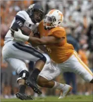  ?? AMY SMOTHERMAN BURGESS — THE ASSOCIATED PRESS ?? Tennessee defensive end Derek Barnett sacks Utah State quarterbac­k Chuckie Keeton in 2014. The Eagles hope that Barnett brings those pass rushing skills to Philadelph­ia.