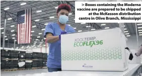  ??  ?? Boxes containing the Moderna vaccine are prepared to be shipped at the McKesson distributi­on centre in Olive Branch, Mississipp­i