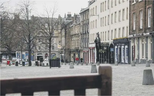  ??  ?? 0 Pubs in Edinburgh’s Grassmarke­t will be forced to close again, as throughout the whole of the nation, bar the islands