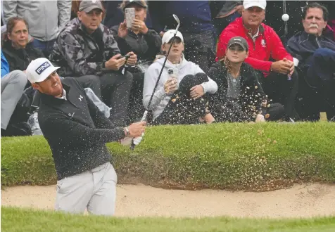  ?? MICHAEL MADRID-USA TODAY SPORTS ?? Mito Pereira hits out of a 16th hole bunker during Saturday's third round of the PGA Championsh­ip at Southern Hills Country Club. He leads the field by three strokes going into today's final round.