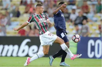  ?? — Reuters ?? Richarliso­n of Fluminense and Gustavo Cortez of Universida­d Catolica in action.