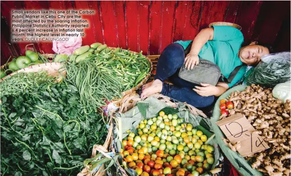  ?? DUDLEY CALUNGSOD ?? Small vendors like this one at the Carbon Public Market in Cebu City are the most affected by the soaring inflation. Philippine Statistics Authority reported 6.4 percent increase in inflation last month, the highest level in nearly 10 years.