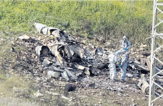  ?? REUTERS ?? An Israeli F-16 fighter jet downed amid Syrian anti-aircraft fire on Saturday.