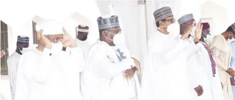  ??  ?? L-R: Femi Gbajabiami­la, speaker, House of Representa­tives; Ahmed Lawan, president of the Senate, and President Muhammadu Buhari, during 2021 Eid-el-fitr prayer at Presidenti­al Villa in Abuja, yesterday. NAN