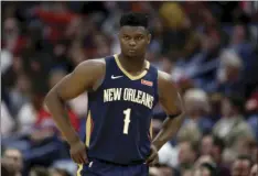  ?? RUSTY COSTANZA
AP FILE PHOTO/ ?? In this March 6 file photo, New Orleans Pelicans forward Zion Williamson walks onto the court during the second half of the team’s NBA basketball game against the Miami Heat in New Orleans.