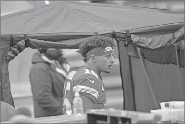  ?? Associated Press ?? Cleared to play: Kansas City Chiefs quarterbac­k Patrick Mahomes enters the injury tent during the second half of an NFL divisional round football game against the Cleveland Browns Sunday in Kansas City.