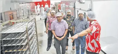  ?? Picture: ATU RASEA ?? Invited guest tour The Hot Bread Kitchen’s new factory after the opening at the Lyndhurst
Warehouse at the Kalabu Tax Free Zone yesterday.