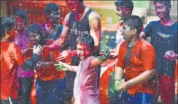  ?? RAJ K RAJ/HT PHOTO ?? Children play with coloured water during Holi in New Delhi on Friday.