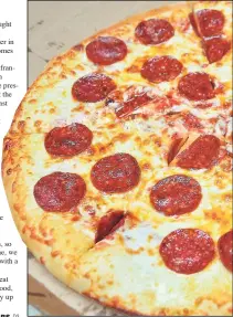  ??  ?? Hot and ready pepperoni pizza from Little Caesars.
