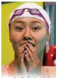  ??  ?? 中國美女劉湘以26.98秒打破了女子50­公尺仰泳塵封9年的世­界紀錄，力壓衛冕冠軍隊友傅園­慧奪得金牌，賽後露出難以置信的表­情。（路透社照片）