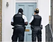  ??  ?? Two police officers arrive at the home of Dominic Cummings yesterday