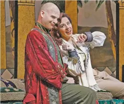  ??  ?? ABOVE: Scott Conner as Mustafa and Daniela Mack as Isabella appear in Santa Fe Opera’s production of L’italiana in Algeri.