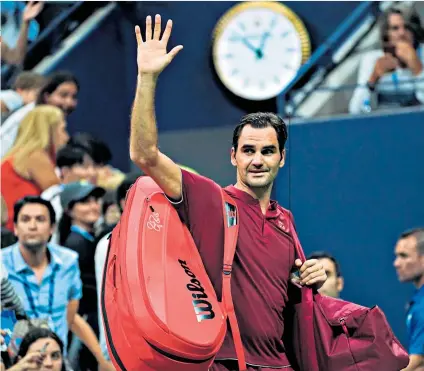  ??  ?? Heat wave: Switzerlan­d’s Roger Federer acknowledg­es the crowd after losing his match against John Millman of Australia