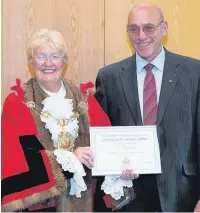  ?? ADAM JEFFERSON ?? Ted Parker receives his award from the Mayor of Rushmoor Cllr Diane Bedford.