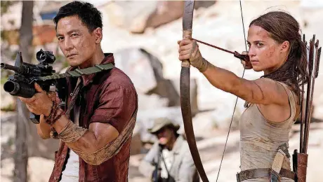  ?? [PHOTO PROVIDED BY ILZE KITSHOFF, WARNER BROS. PICTURES/METRO-GOLDWYN-MAYER PICTURES] ?? Daniel Wu stars as Lu Ren and Alicia Vikander as Lara Croft in “Tomb Raider.”