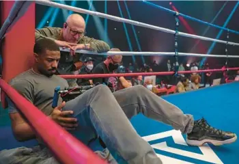  ?? MGM ?? Director and star Michael B. Jordan, left, and cinematogr­apher Kramer Morgenthau are seen on the set of“Creed III.”