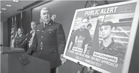  ?? DARRYL DYCK/THE CANADIAN PRESS VIA AP ?? Kevin Hackett of the Royal Canadian Mounted Police shows images of Kam McLeod, 19, and Bryer Schmegelsk­y, 18.